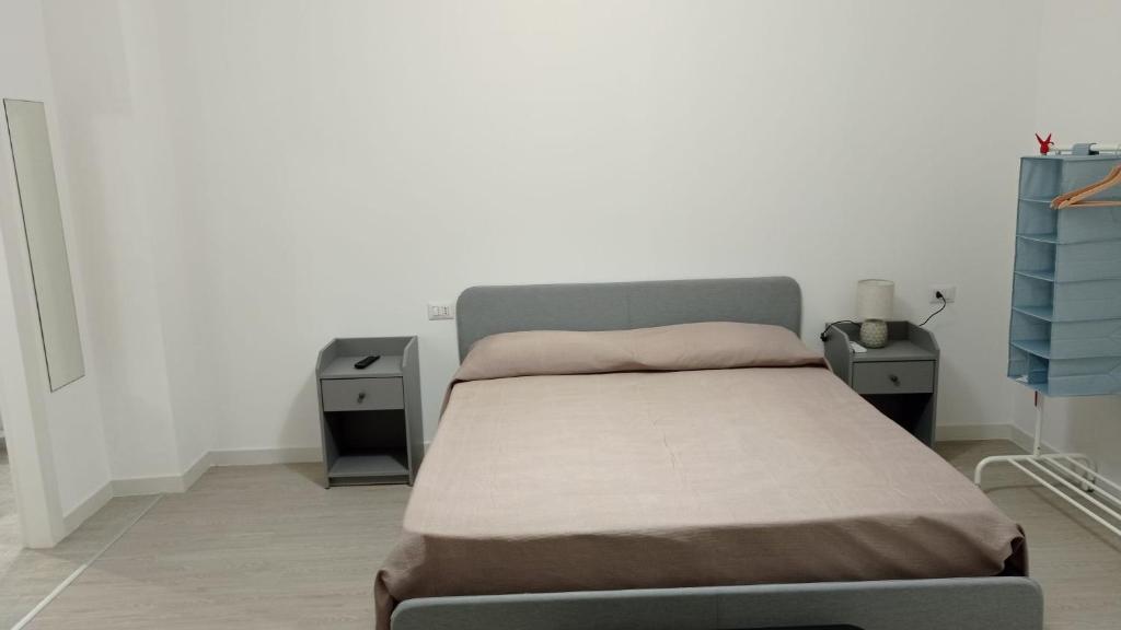 Łóżko lub łóżka w pokoju w obiekcie Rosa's Rooms