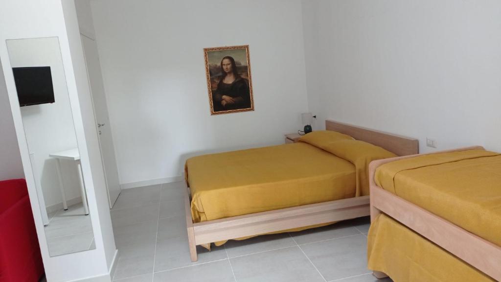 Łóżko lub łóżka w pokoju w obiekcie Rosa's Rooms