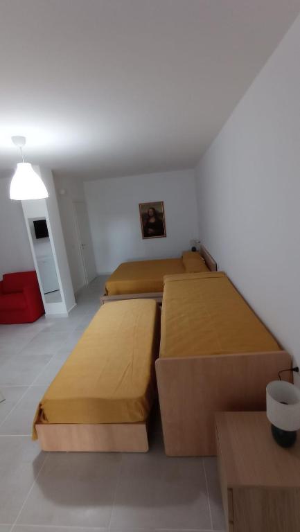 Łóżko lub łóżka w pokoju w obiekcie Rosa's Rooms