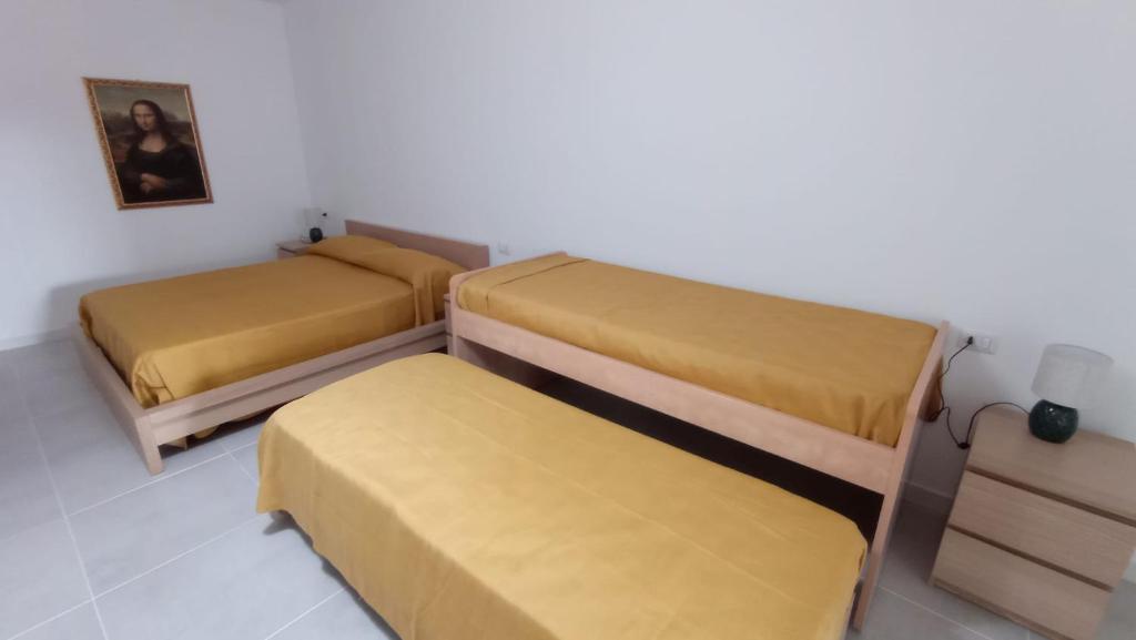 Łóżko lub łóżka w pokoju w obiekcie Rosa's Rooms