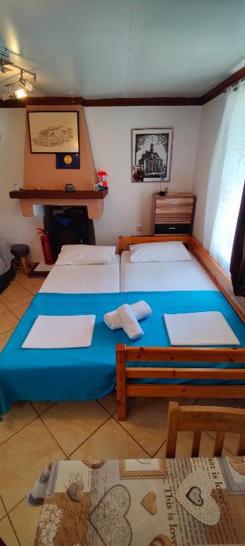 Postel nebo postele na pokoji v ubytování Dalis House
