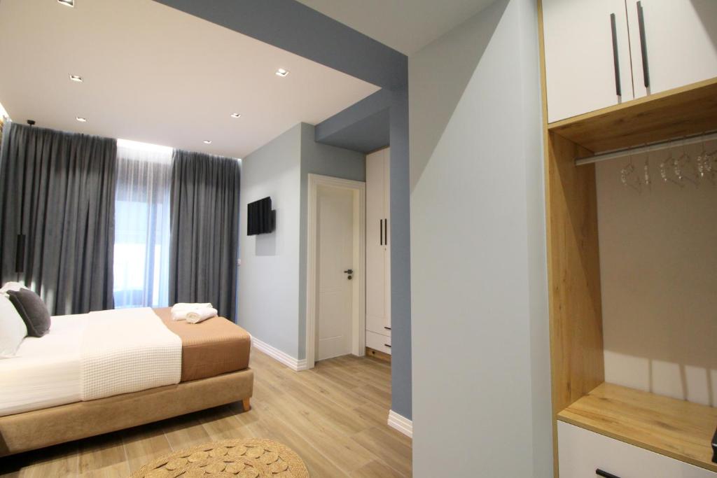 Postel nebo postele na pokoji v ubytování Ngjela Apartments