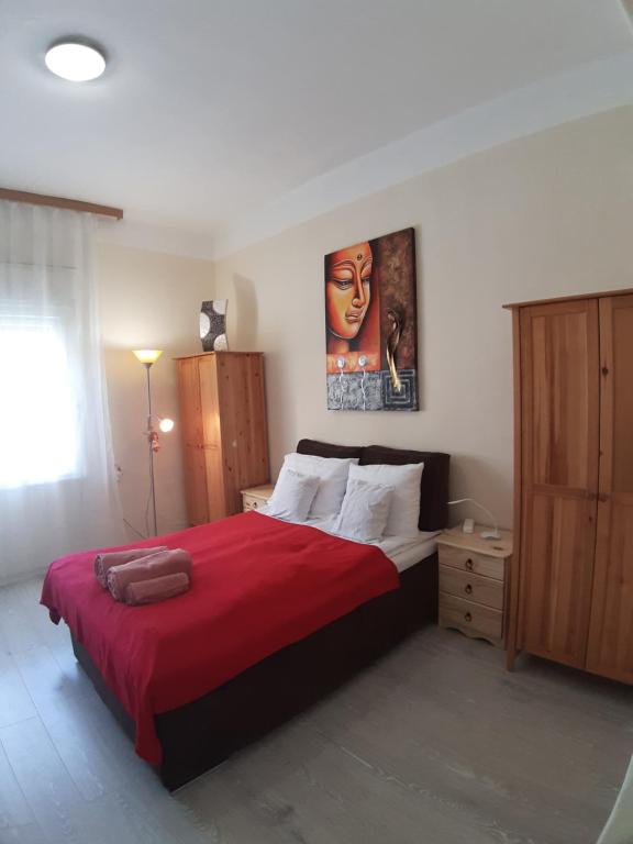 Posteľ alebo postele v izbe v ubytovaní MiniBali Apartmanok