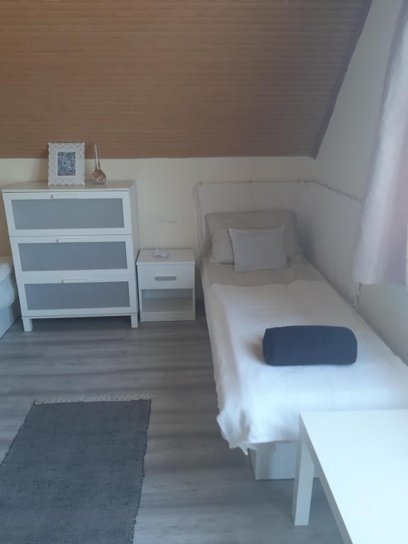 Posteľ alebo postele v izbe v ubytovaní MiniBali Apartmanok