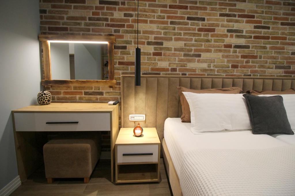 Postel nebo postele na pokoji v ubytování Ngjela Apartments
