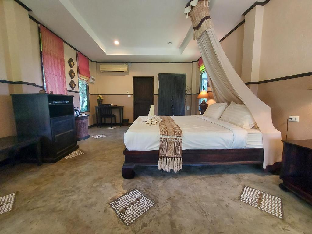 Postel nebo postele na pokoji v ubytování Baan Chai Thung Resort