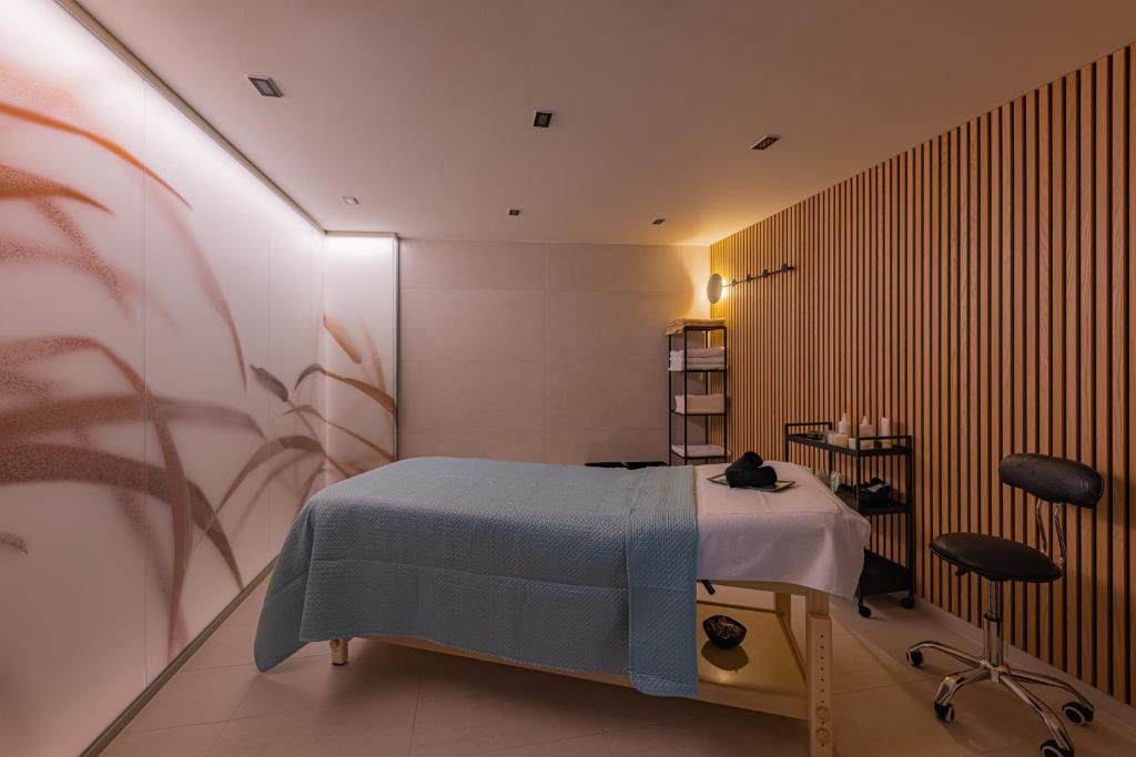 A bed or beds in a room at LUA Resort - Adults only
