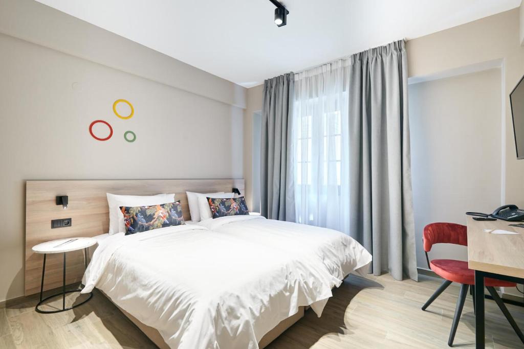 Postel nebo postele na pokoji v ubytování The Mavili urban stay