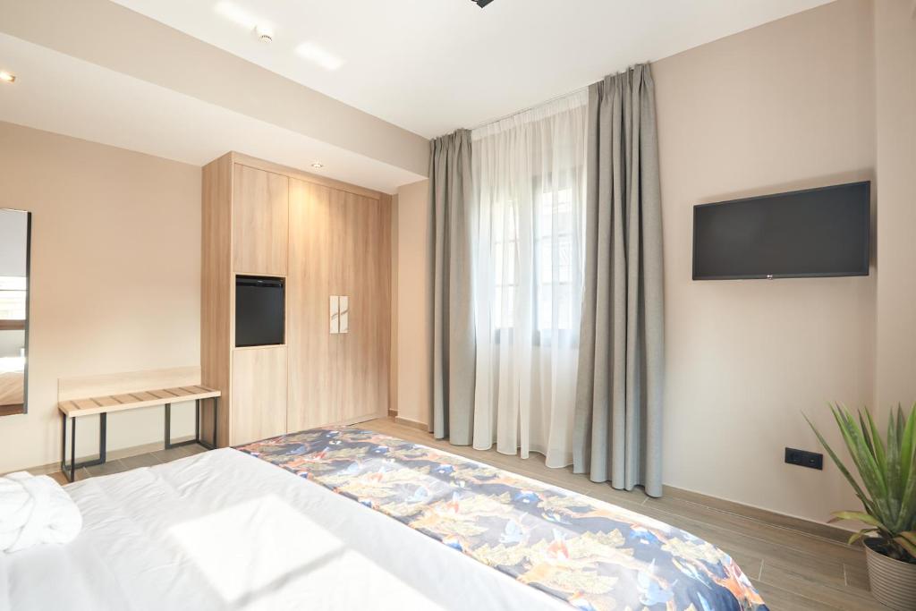 Postel nebo postele na pokoji v ubytování The Mavili urban stay