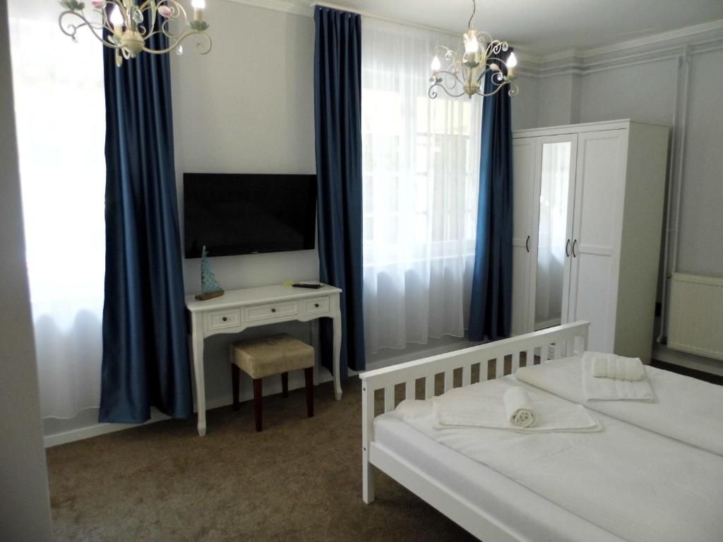 Postel nebo postele na pokoji v ubytování Millennium Villa