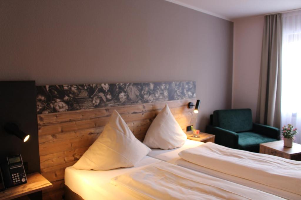 Postel nebo postele na pokoji v ubytování Hotel Häußler