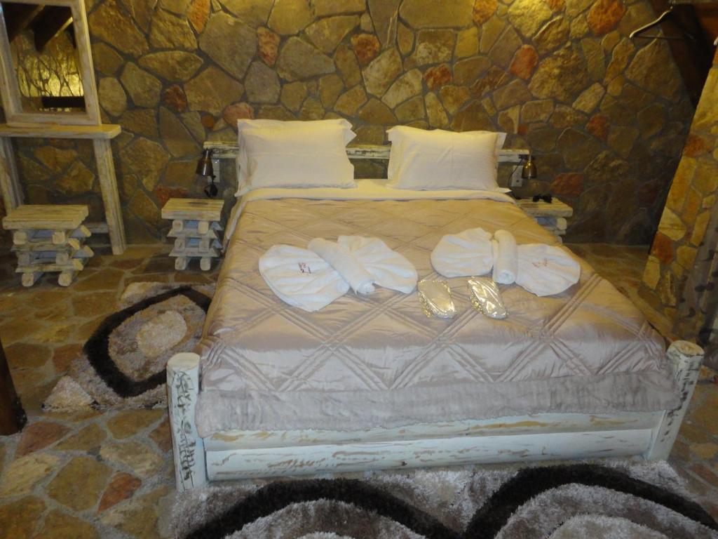 Posteľ alebo postele v izbe v ubytovaní eco oneiro resort