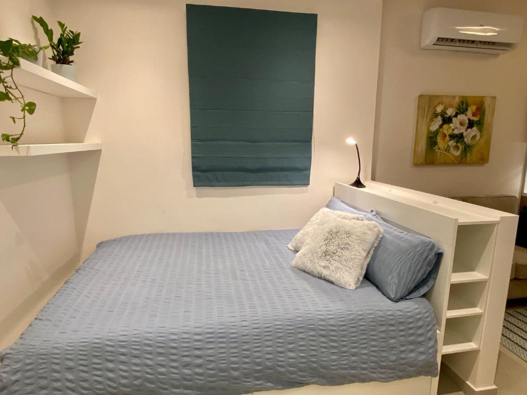 Postel nebo postele na pokoji v ubytování Mosta Garden Studio