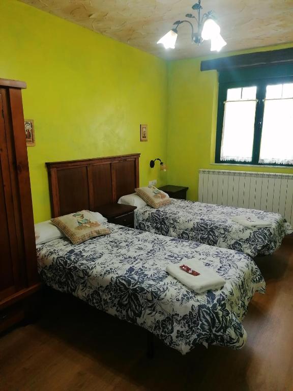 Postel nebo postele na pokoji v ubytování Hostería Casa Flor