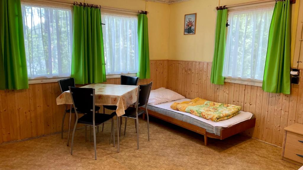 Postel nebo postele na pokoji v ubytování Chatový areál ATLAS