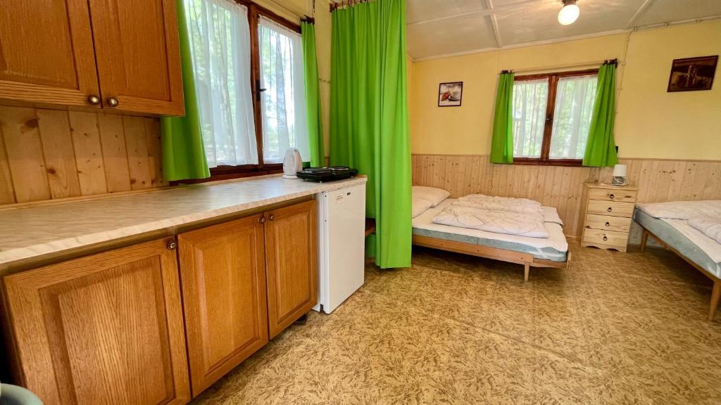 Postel nebo postele na pokoji v ubytování Chatový areál ATLAS