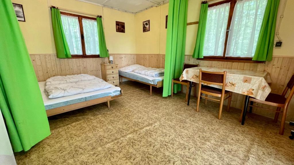 Postel nebo postele na pokoji v ubytování Chatový areál ATLAS