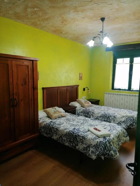 Postel nebo postele na pokoji v ubytování Hostería Casa Flor