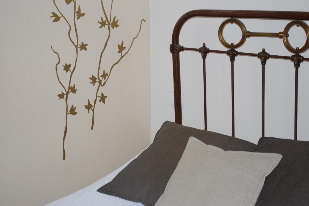 Postel nebo postele na pokoji v ubytování L'Hôtel L'Astrée