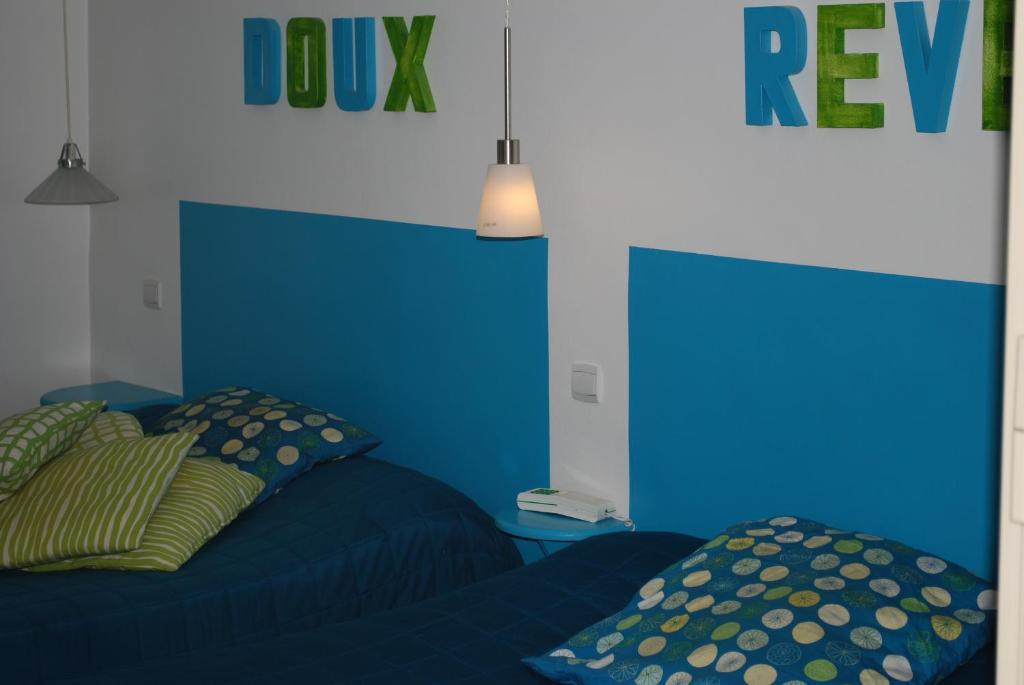Postel nebo postele na pokoji v ubytování L'Hôtel L'Astrée