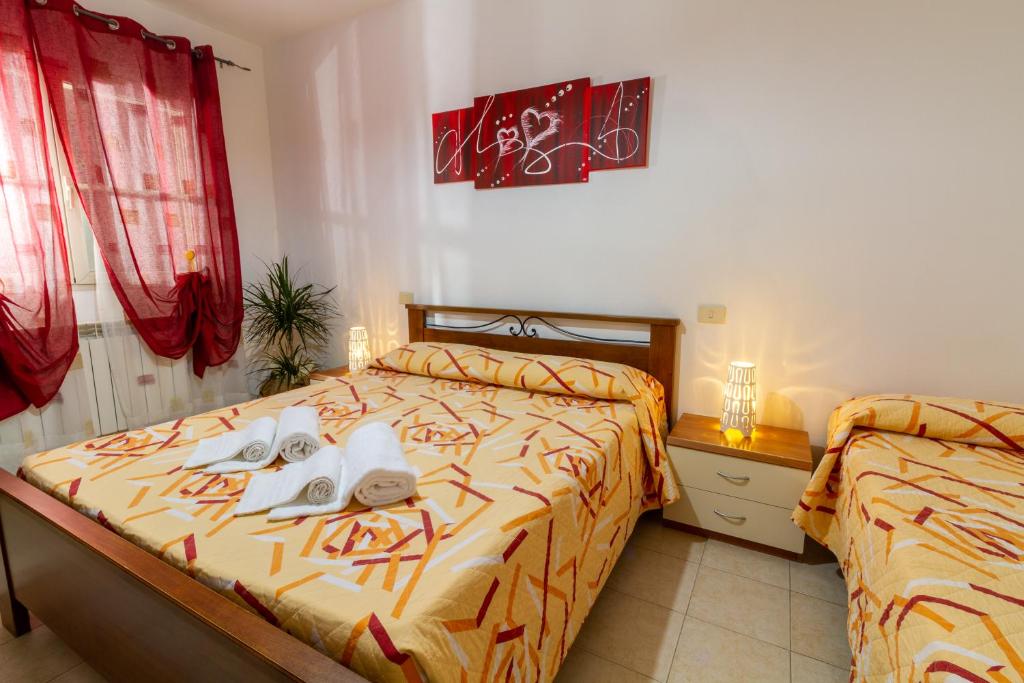 Postel nebo postele na pokoji v ubytování Agriturismo Fusini
