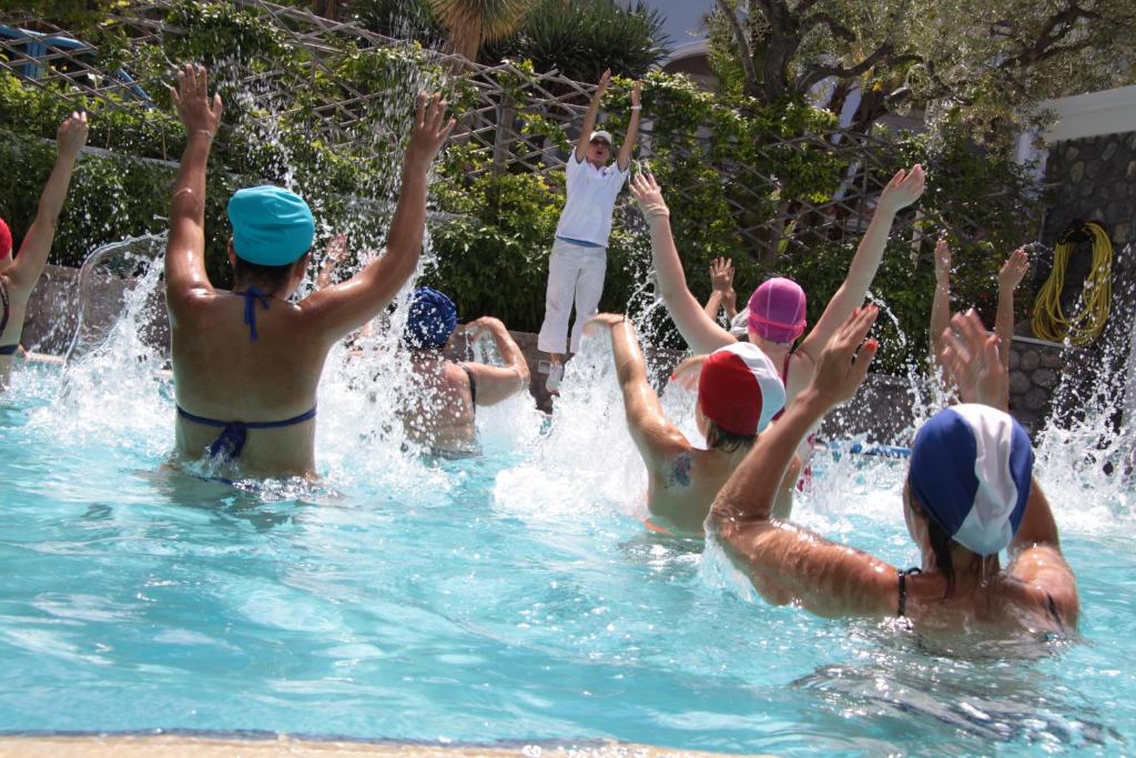 a group of people playing in a swimming pool at Sorriso Thermae Resort & Spa in Ischia