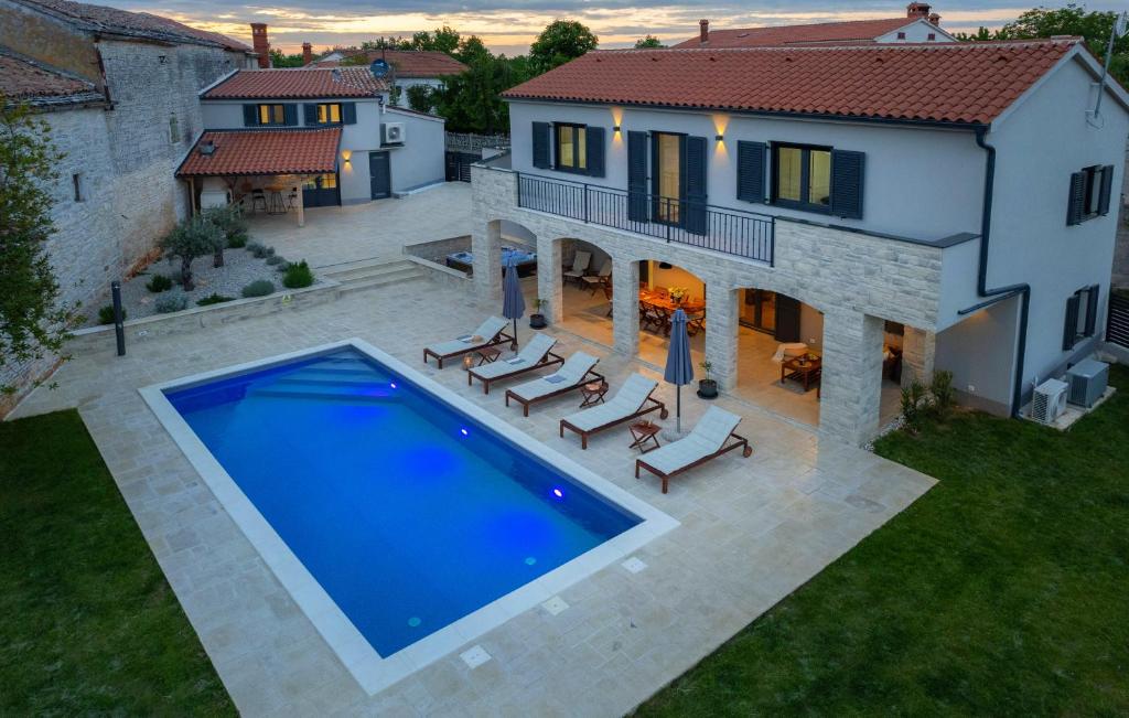 an aerial view of a house with a swimming pool at Villa Ajda with heated privat pool, jacuzzi, sauna, 4 bedroom, 4 bathroom in Svetvinčenat