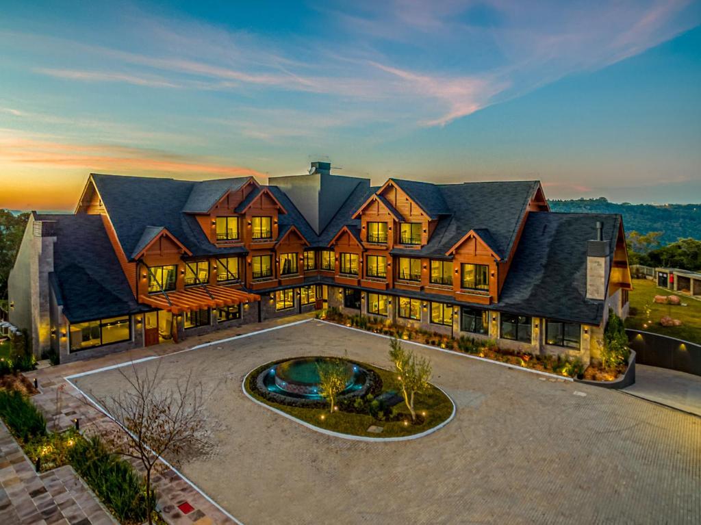 an aerial view of a large house with a fountain at Chateau Laghetto Collection in Gramado