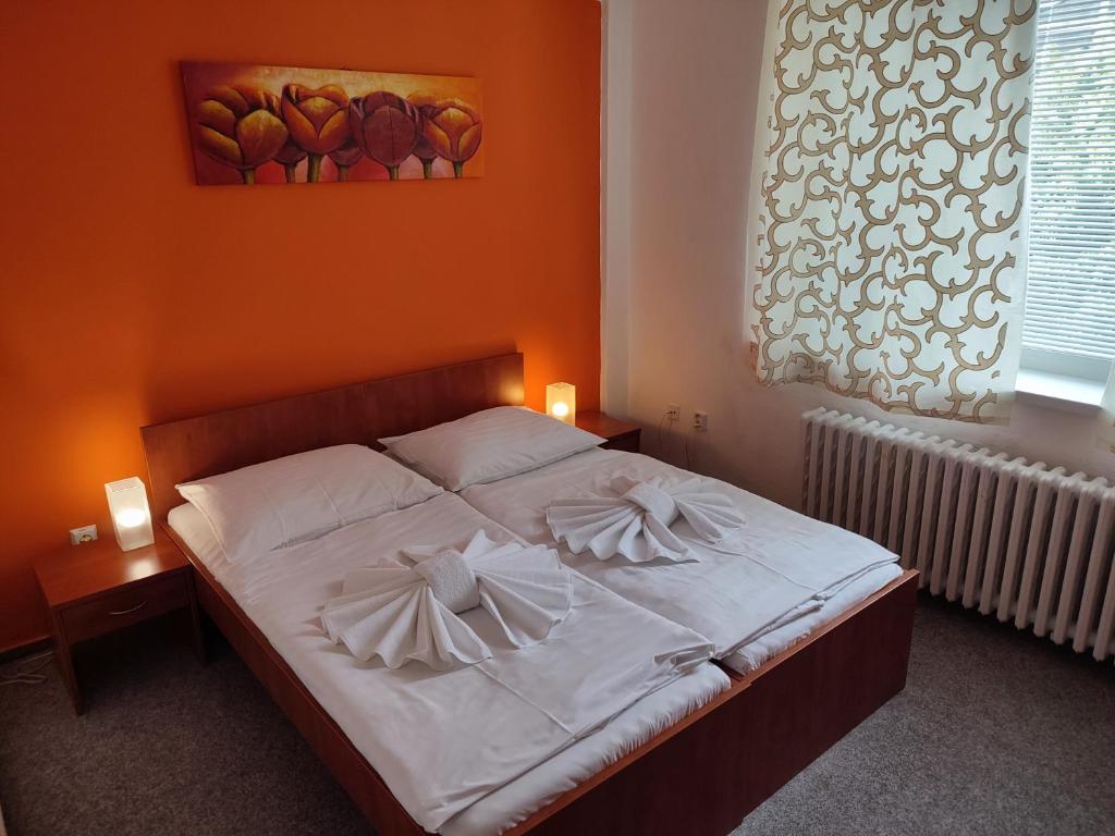 Postel nebo postele na pokoji v ubytování BEST Hotel Garni
