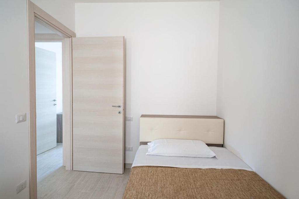 A bed or beds in a room at Sul Calar del Sole al Conero