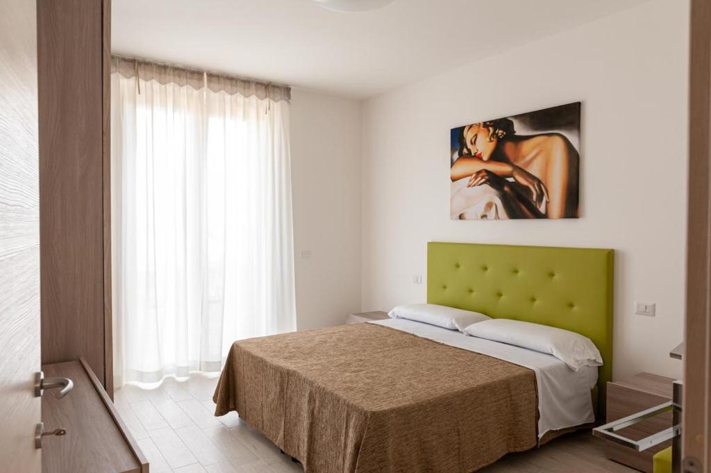 A bed or beds in a room at Sul Calar del Sole al Conero