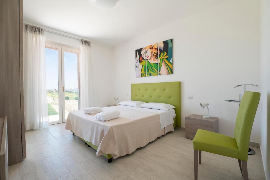 A bed or beds in a room at Sul Calar del Sole al Conero