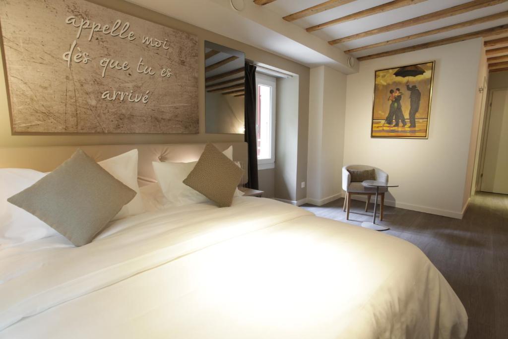 Postel nebo postele na pokoji v ubytování Chez Maman Hotel & Restaurant