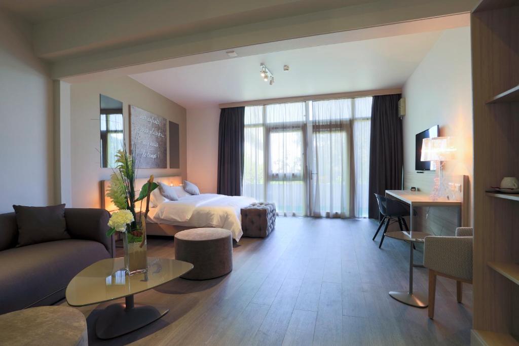 Postel nebo postele na pokoji v ubytování Chez Maman Hotel & Restaurant