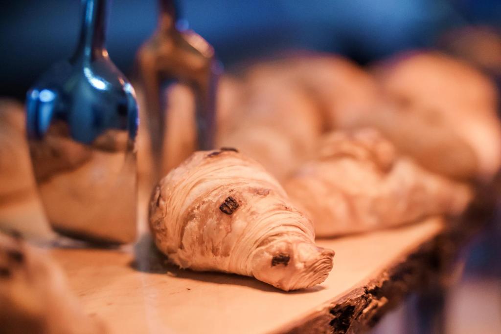 a loaf of bread on a table next to a bottle of wine at Pavlo Napa Beach Hotel in Ayia Napa