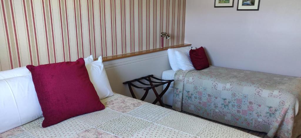 Postel nebo postele na pokoji v ubytování Teac Campbell Guesthouse