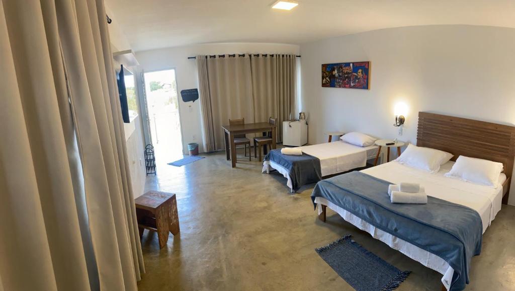 Postel nebo postele na pokoji v ubytování Pousada Morada Caninde