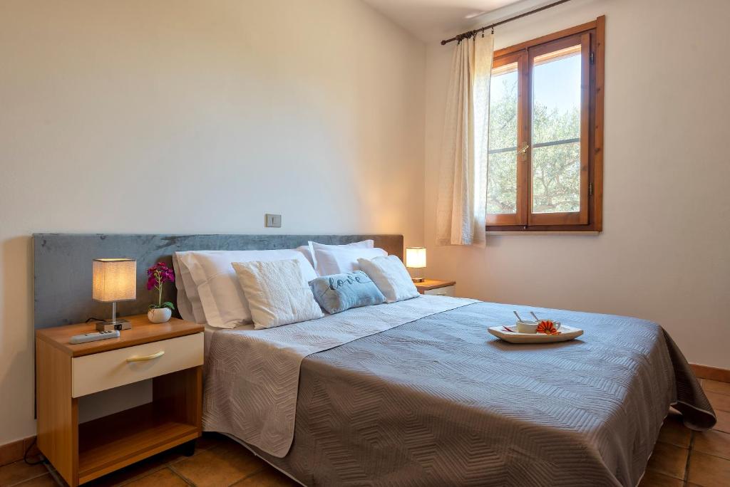 Postel nebo postele na pokoji v ubytování Villa Grazia