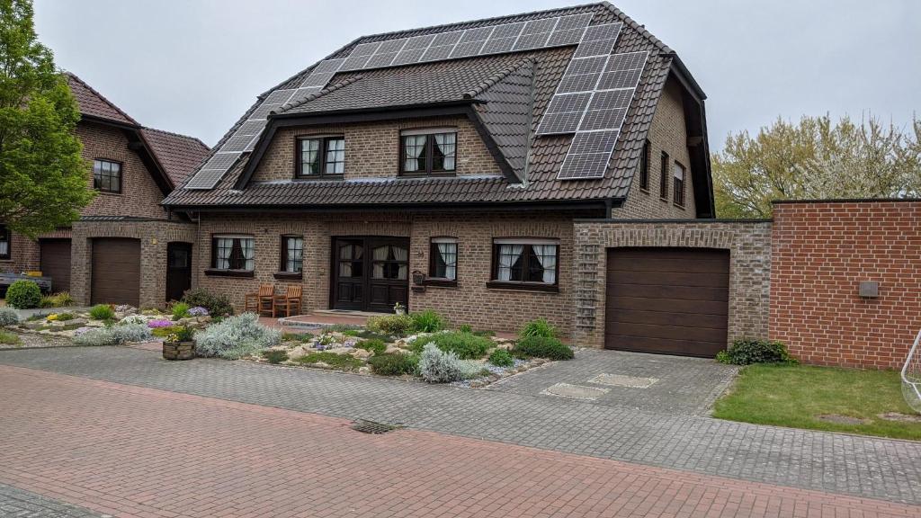 a house with a lot of solar panels on its roof at Haus Münsterland in Nordwalde