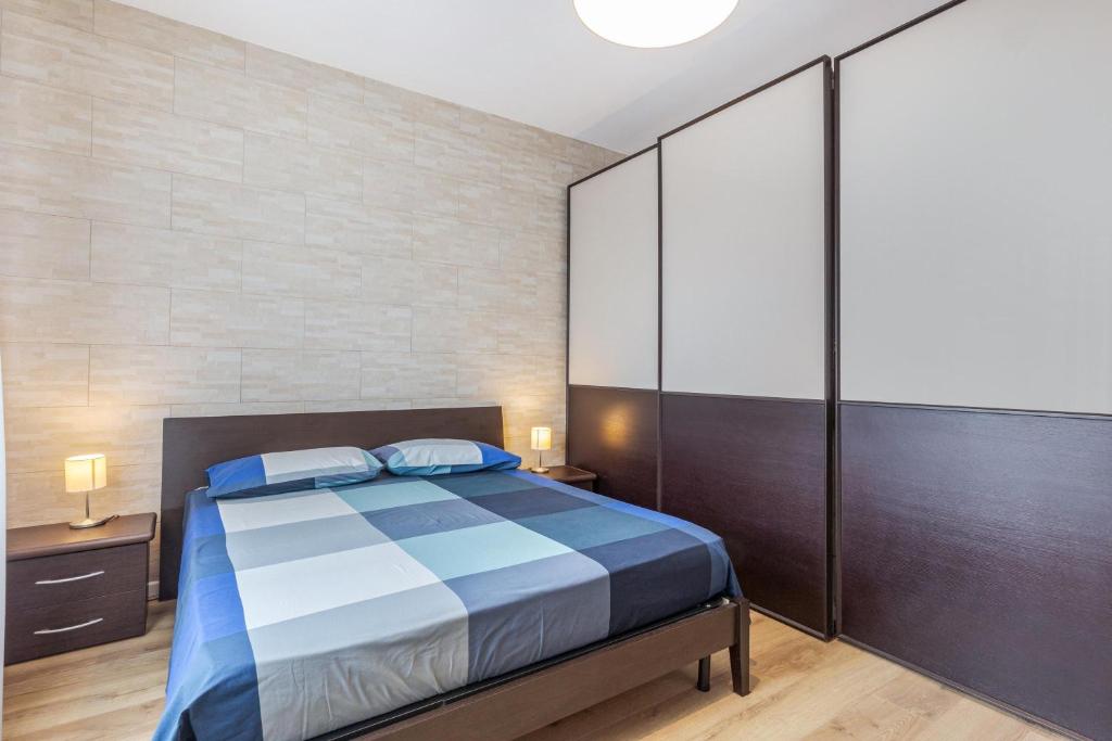 Łóżko lub łóżka w pokoju w obiekcie Queen East Verona Appartamenti