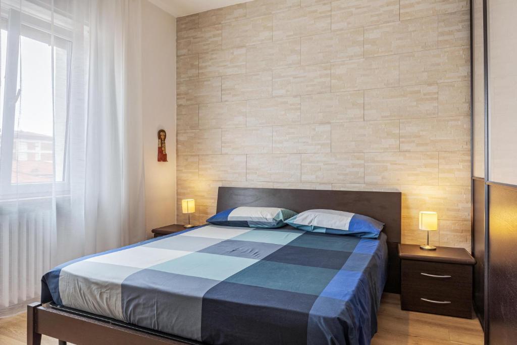 Łóżko lub łóżka w pokoju w obiekcie Queen East Verona Appartamenti