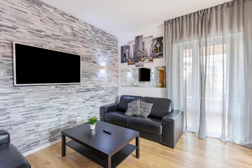 Telewizja i/lub zestaw kina domowego w obiekcie Queen East Verona Appartamenti