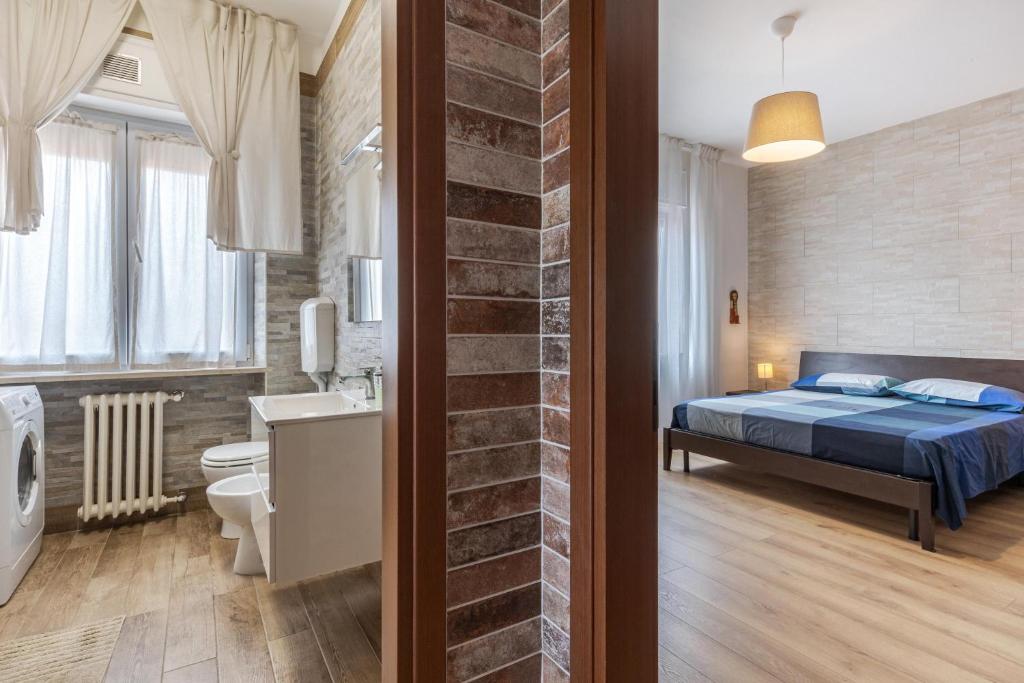 Łóżko lub łóżka w pokoju w obiekcie Queen East Verona Appartamenti