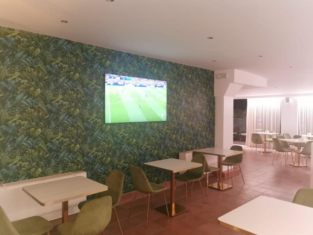 TV a/nebo společenská místnost v ubytování Hotel Palladium Palace