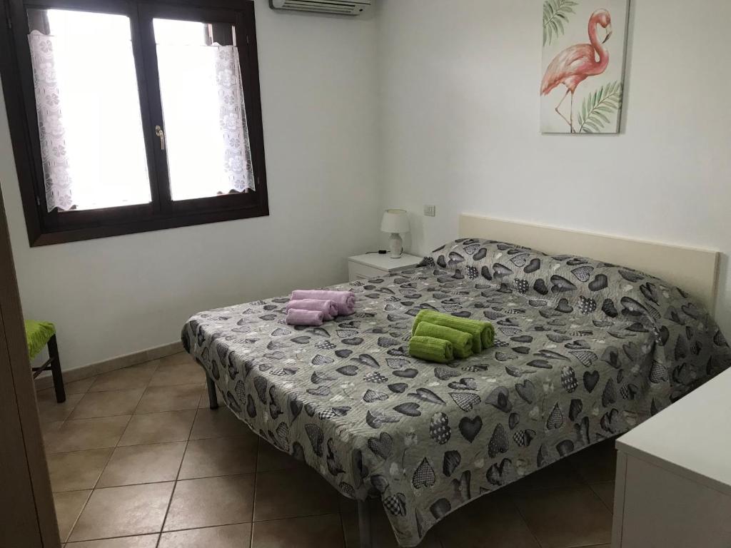 Łóżko lub łóżka w pokoju w obiekcie Olbia House