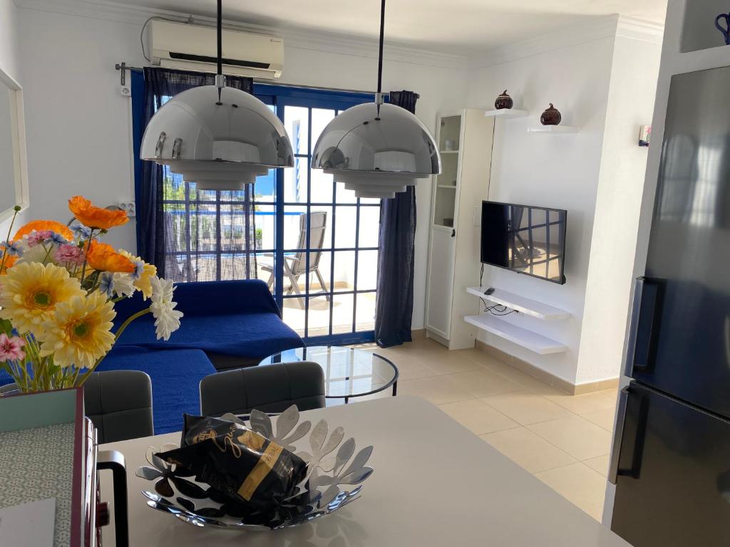 A television and/or entertainment centre at NEW Atalaya - Amazing Sea Views&Fantastic Pool