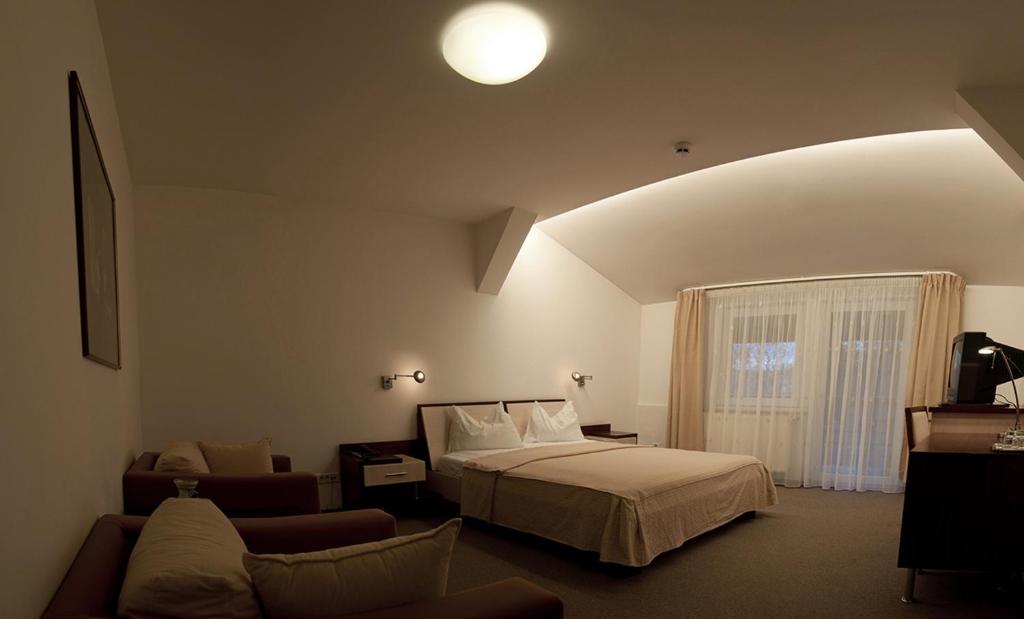 Postel nebo postele na pokoji v ubytování Hotel Baneasa Parc