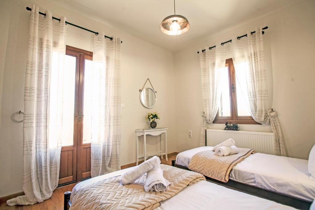 Postel nebo postele na pokoji v ubytování Villa Greco