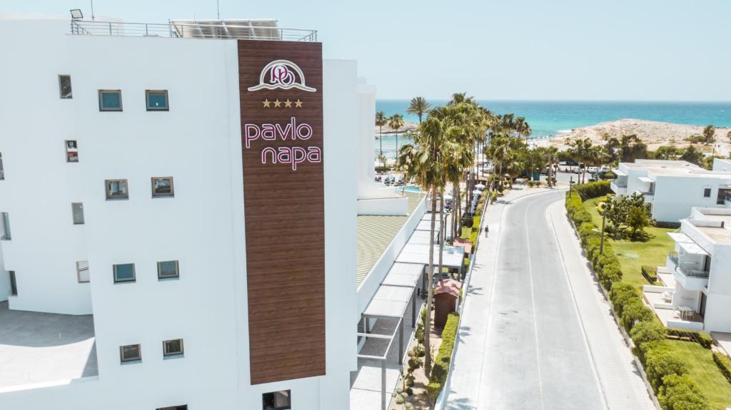 a view of the beach from the balcony of a building at Pavlo Napa Beach Hotel in Ayia Napa