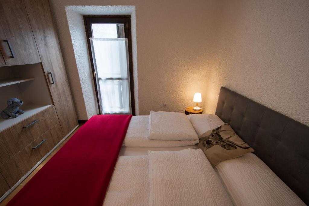 A bed or beds in a room at bb26 apartment mountain Lozio
